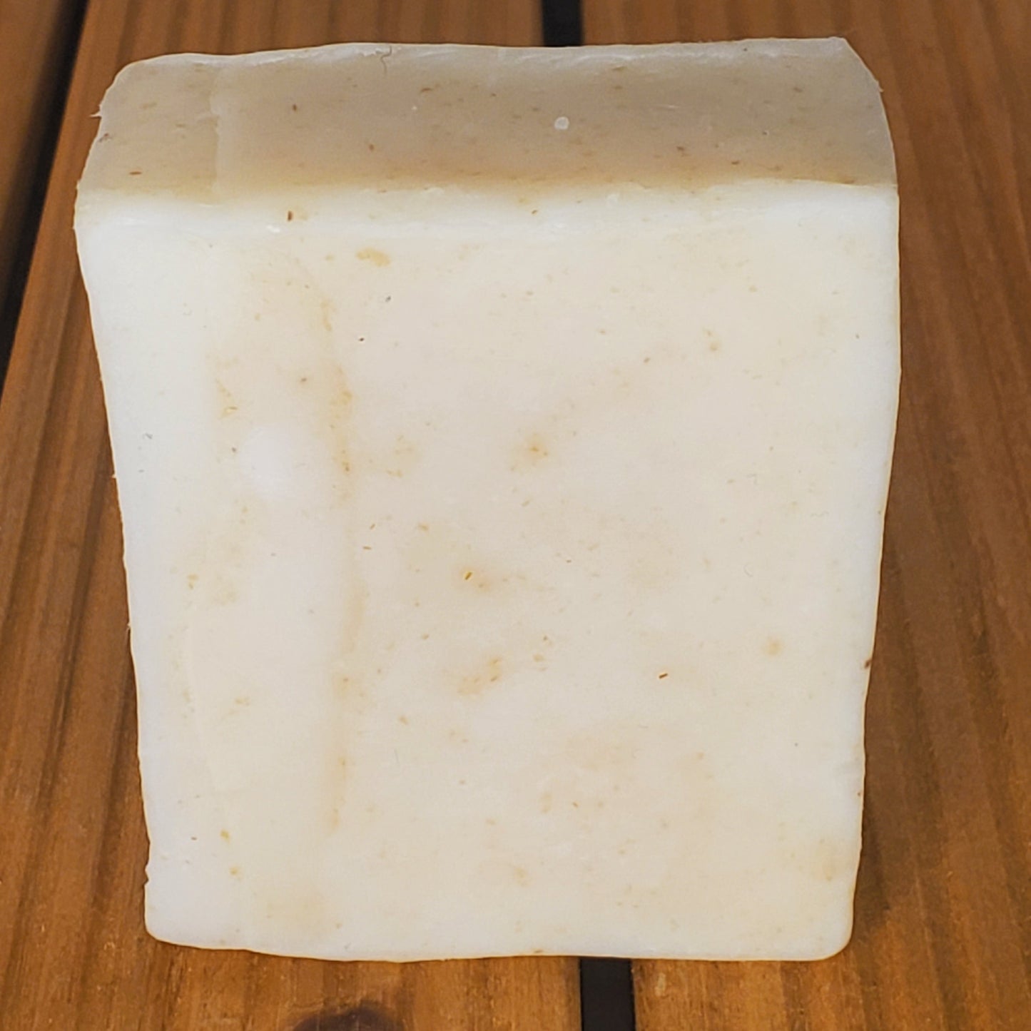 Block of tofu on a wooden surface