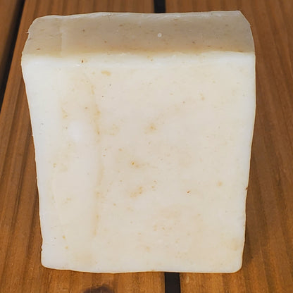 Block of tofu on a wooden surface