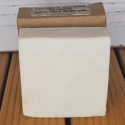 Bar of soap with a cardboard box on a wooden surface