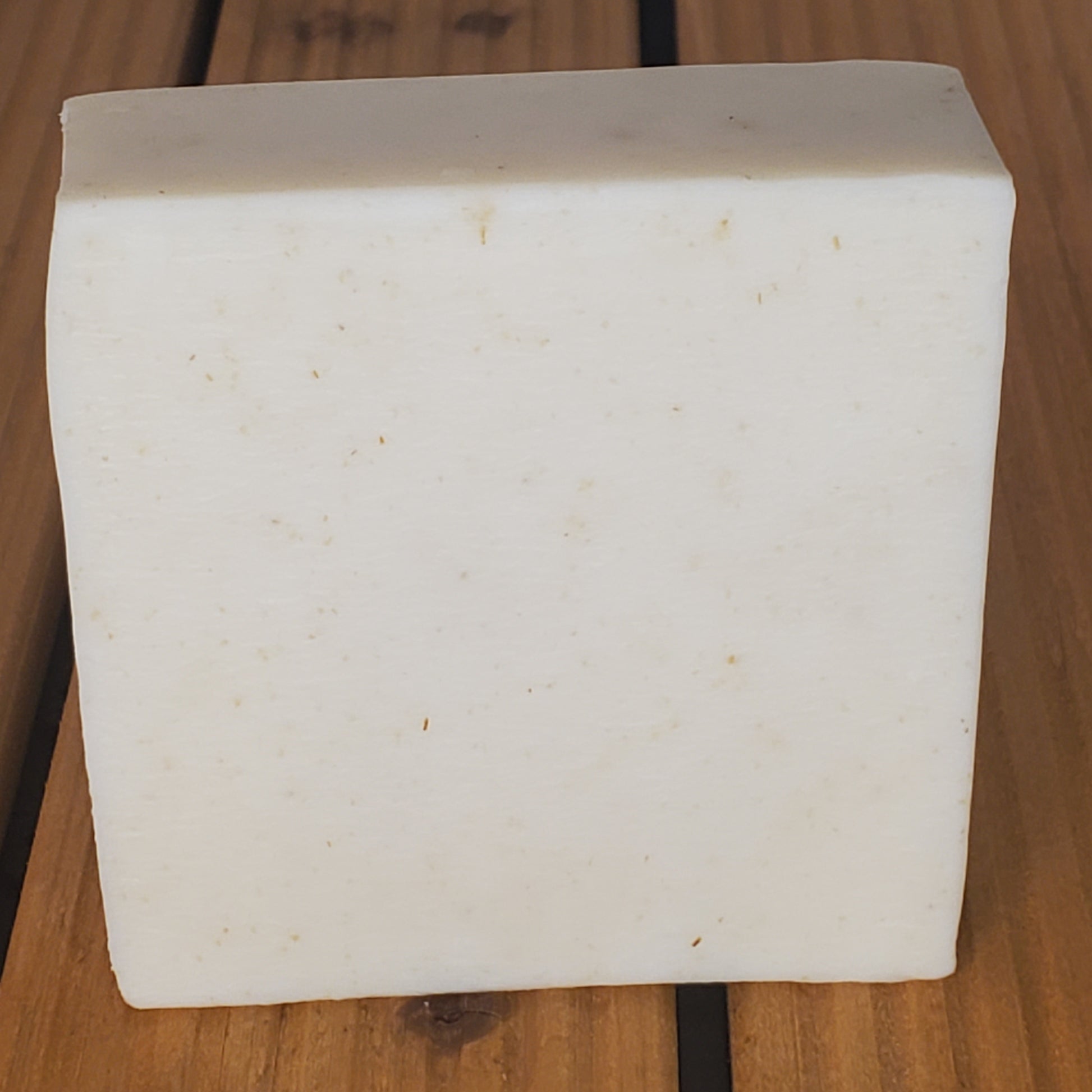 White rectangular block on a wooden surface