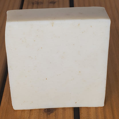 White rectangular block on a wooden surface