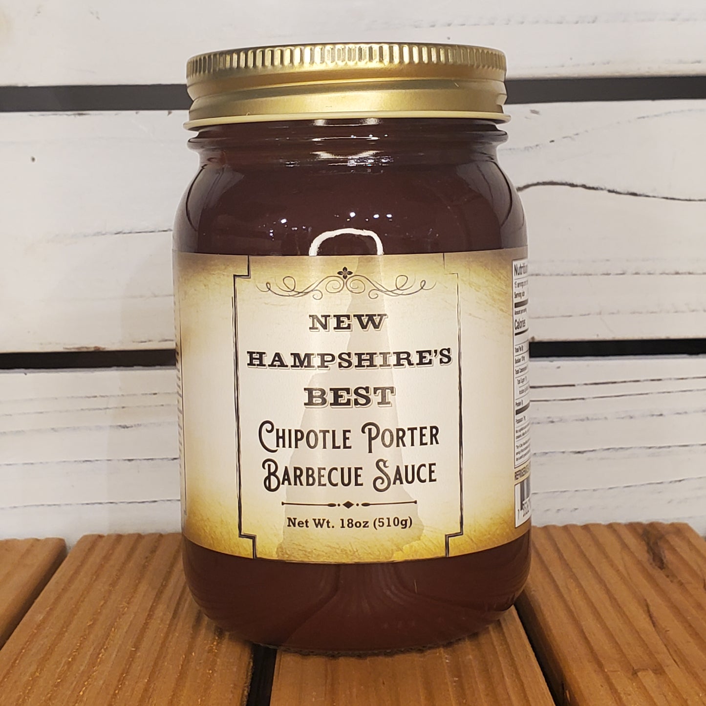 Jar of New Hampshire's Best Chiptole Porter Barbecue Sauce on a wooden surface