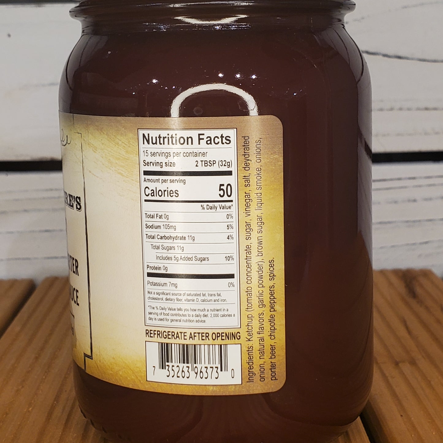 Jar with a nutrition facts label on a wooden surface