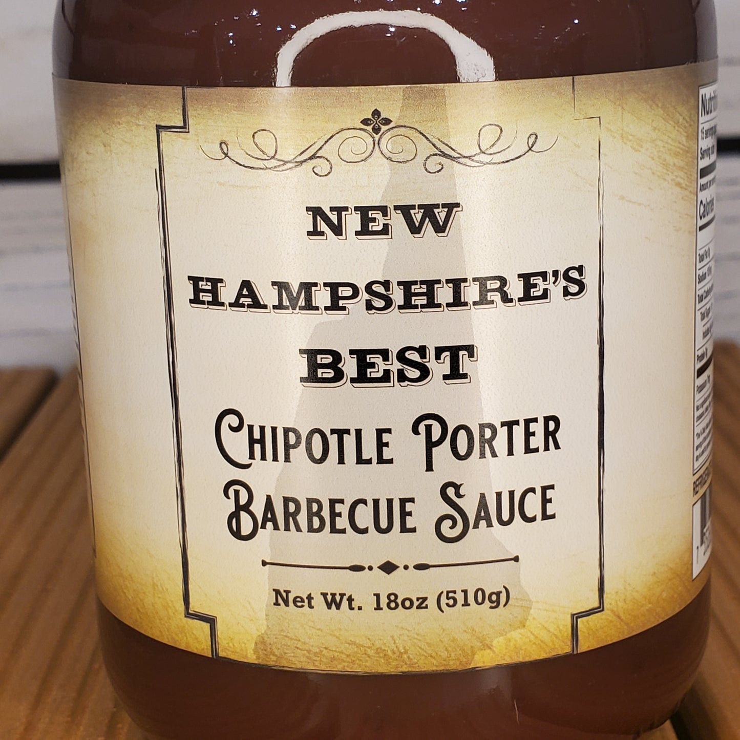 Barbecue sauce jar with label on a wooden surface