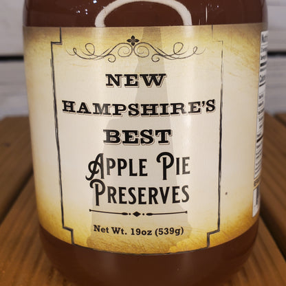Jar of New Hampshire's Best Apple Pie Preserves on a wooden surface