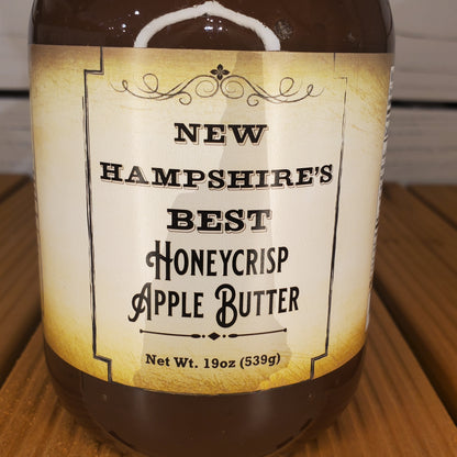 Bottle of New Hampshire's Best Honeycrisp Apple Butter on a wooden surface