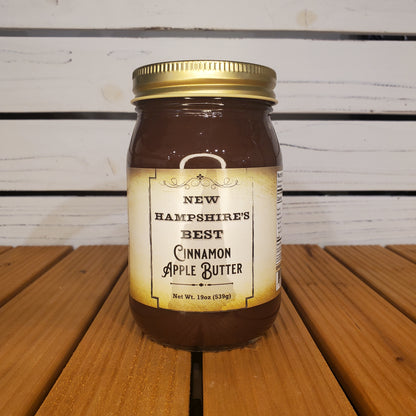 Jar of New Hampshire's Best Cinnamon Apple Butter on a wooden surface