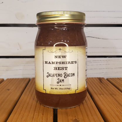 Jar of New Hampshire's Best Jalapeno Bacon Jam on a wooden surface