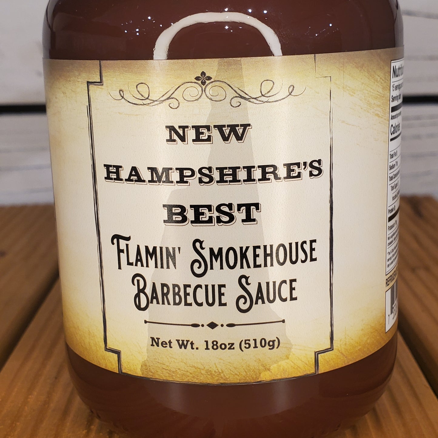 Barbecue sauce jar with label on a wooden surface