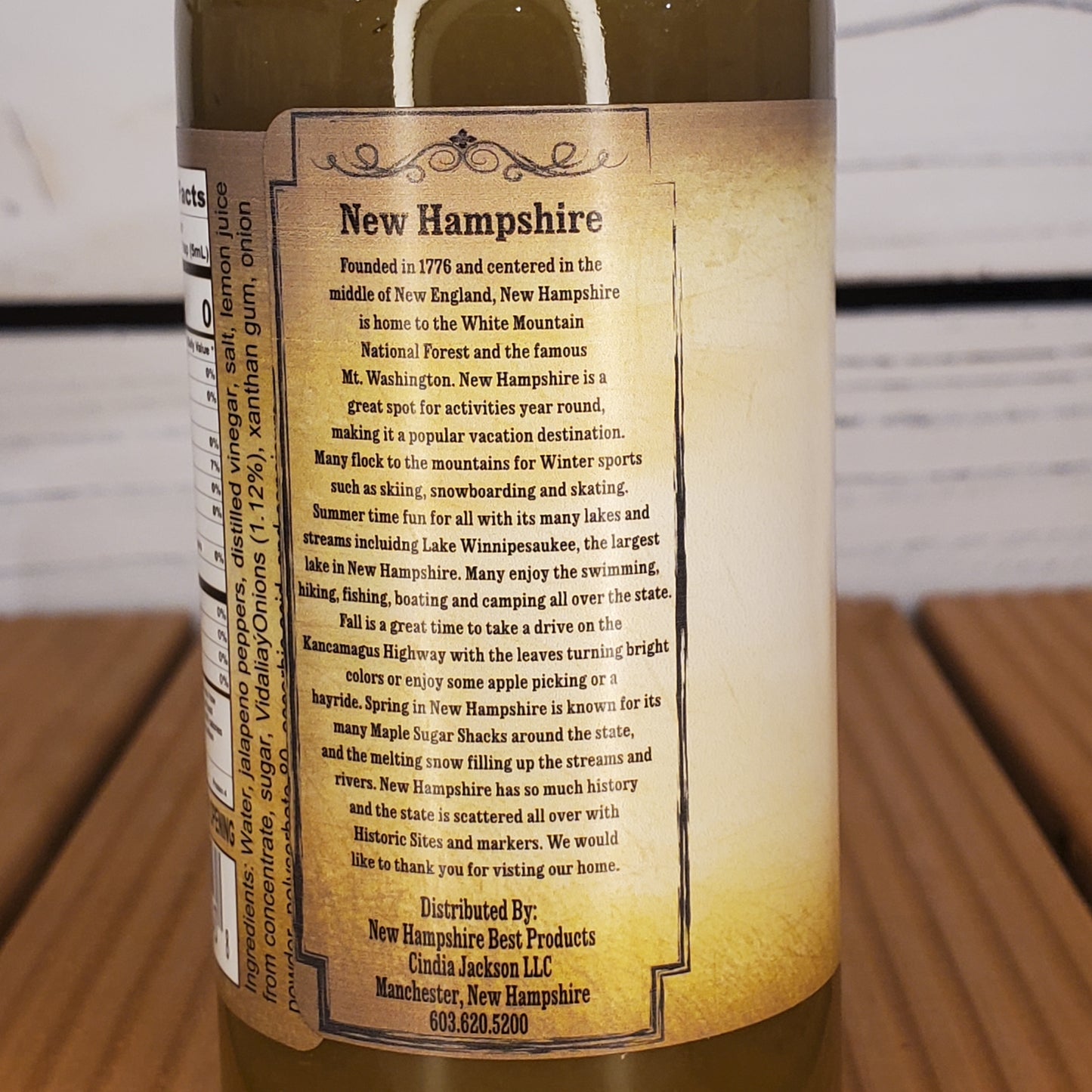Wine bottle label with text on a wooden surface