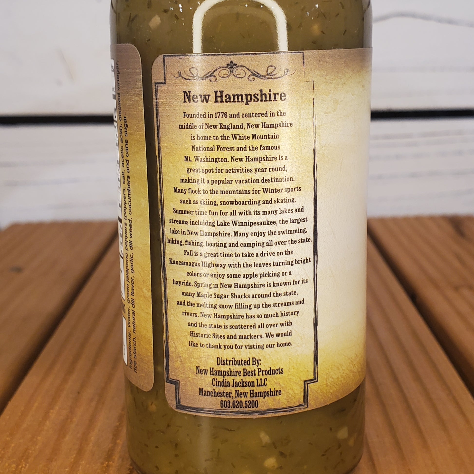 Bottle with a detailed label on a wooden surface