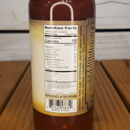Bottle label with nutrition facts on a wooden surface