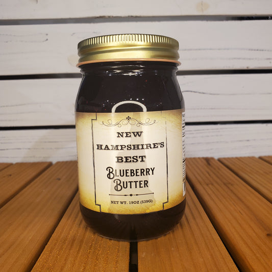 Jar of New Hampshire's Best Blueberry Butter on a wooden surface