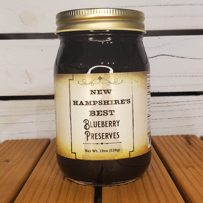 Jar of New Hampshire's Best Blueberry Preserves on a wooden surface