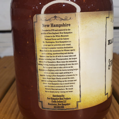 Bottle with a label about New Hampshire on a wooden surface
