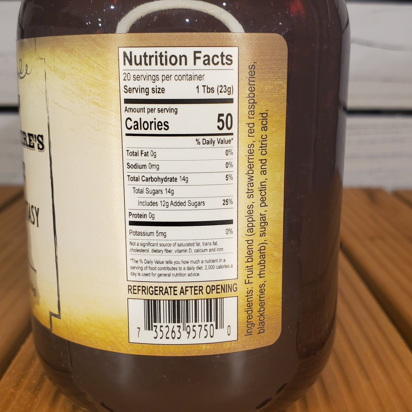Nutrition facts label on a bottle with a wooden surface in the background