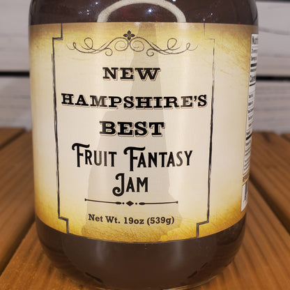 Jar of New Hampshire's Best Fruit Fantasy Jam on a wooden surface