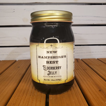 Jar of New Hampshire's Best Elderberry Jelly on a wooden surface