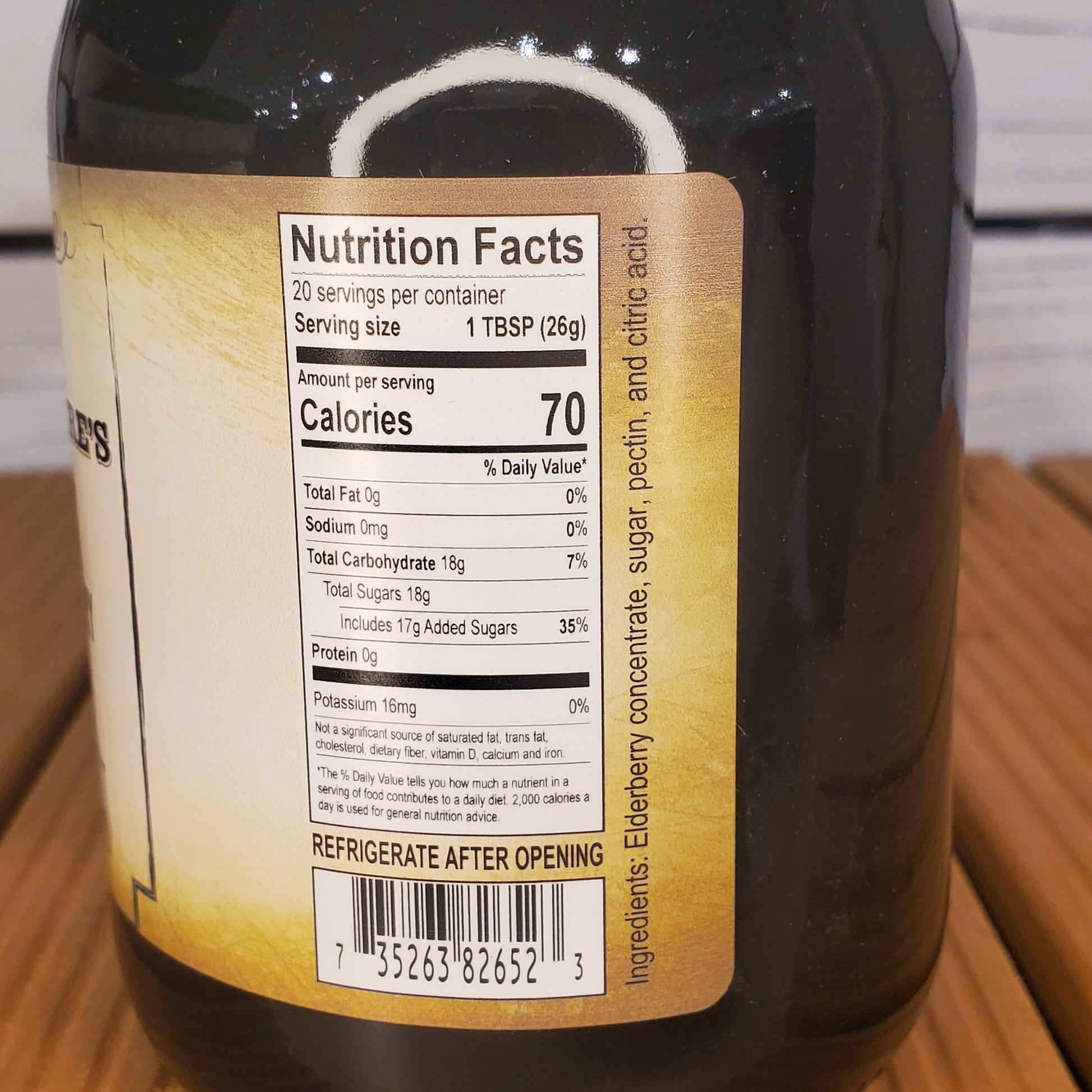 Bottle label with nutrition facts on a wooden surface