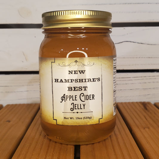 Jar of New Hampshire's Best Apple Cider Jelly on a wooden surface