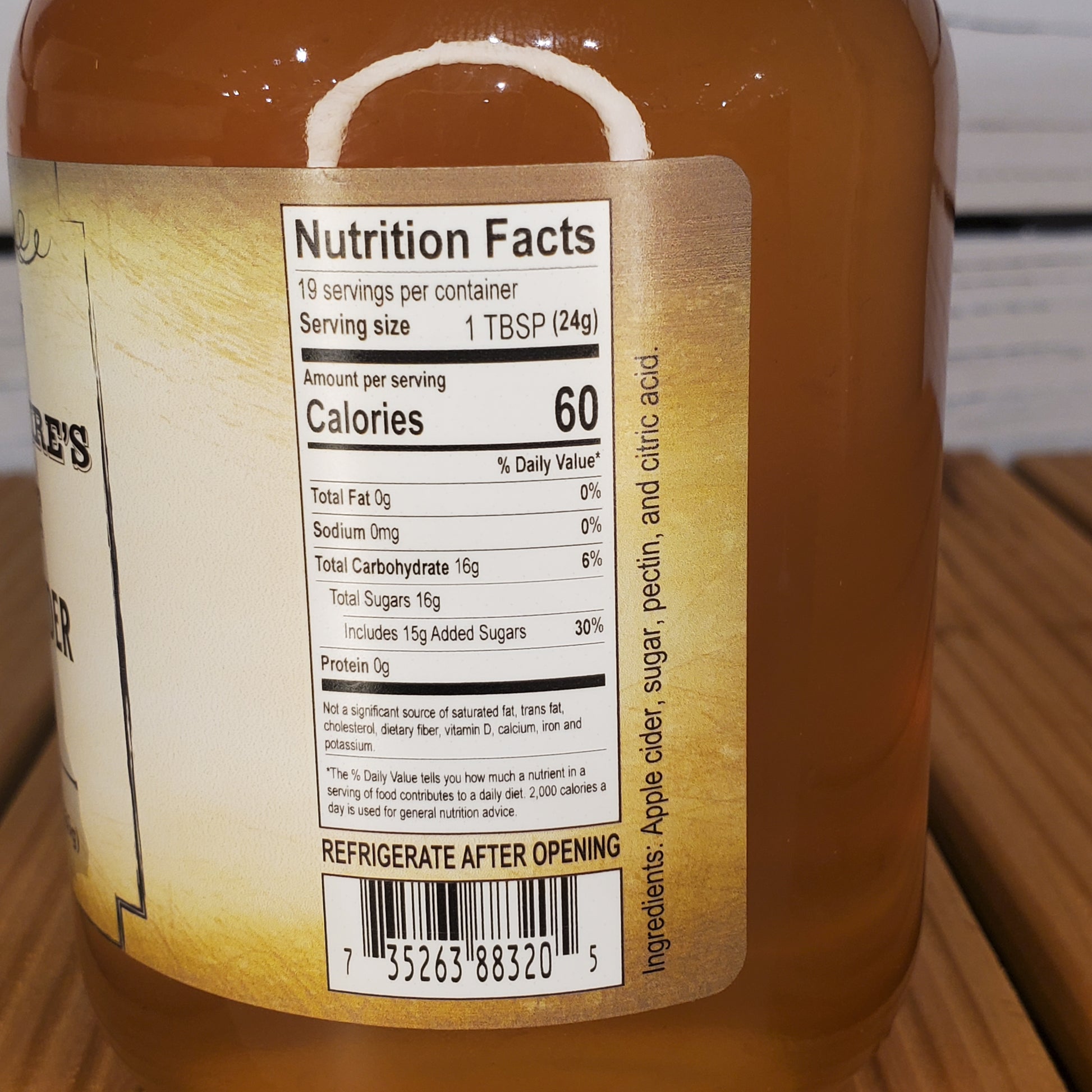 Close-up of a nutrition facts label on a bottle of syrup.