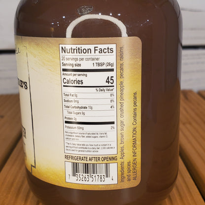 Close-up of a bottle label with nutrition facts on a wooden surface