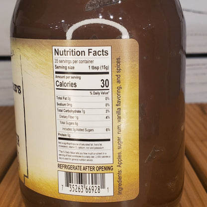 Close-up of a bottle label with nutrition facts on a wooden surface