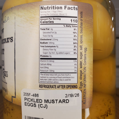 Close-up of pickled mustard eggs with a label showing nutrition facts and storage instructions.