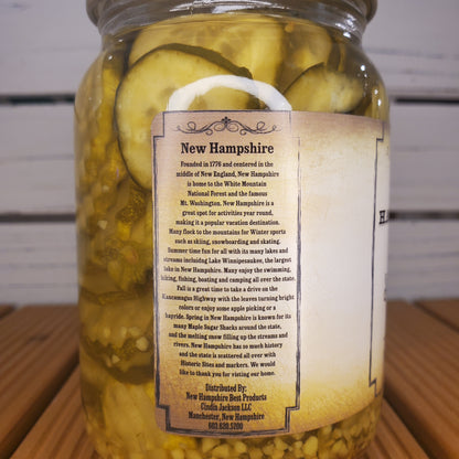 Jar of pickles with a label on a wooden surface