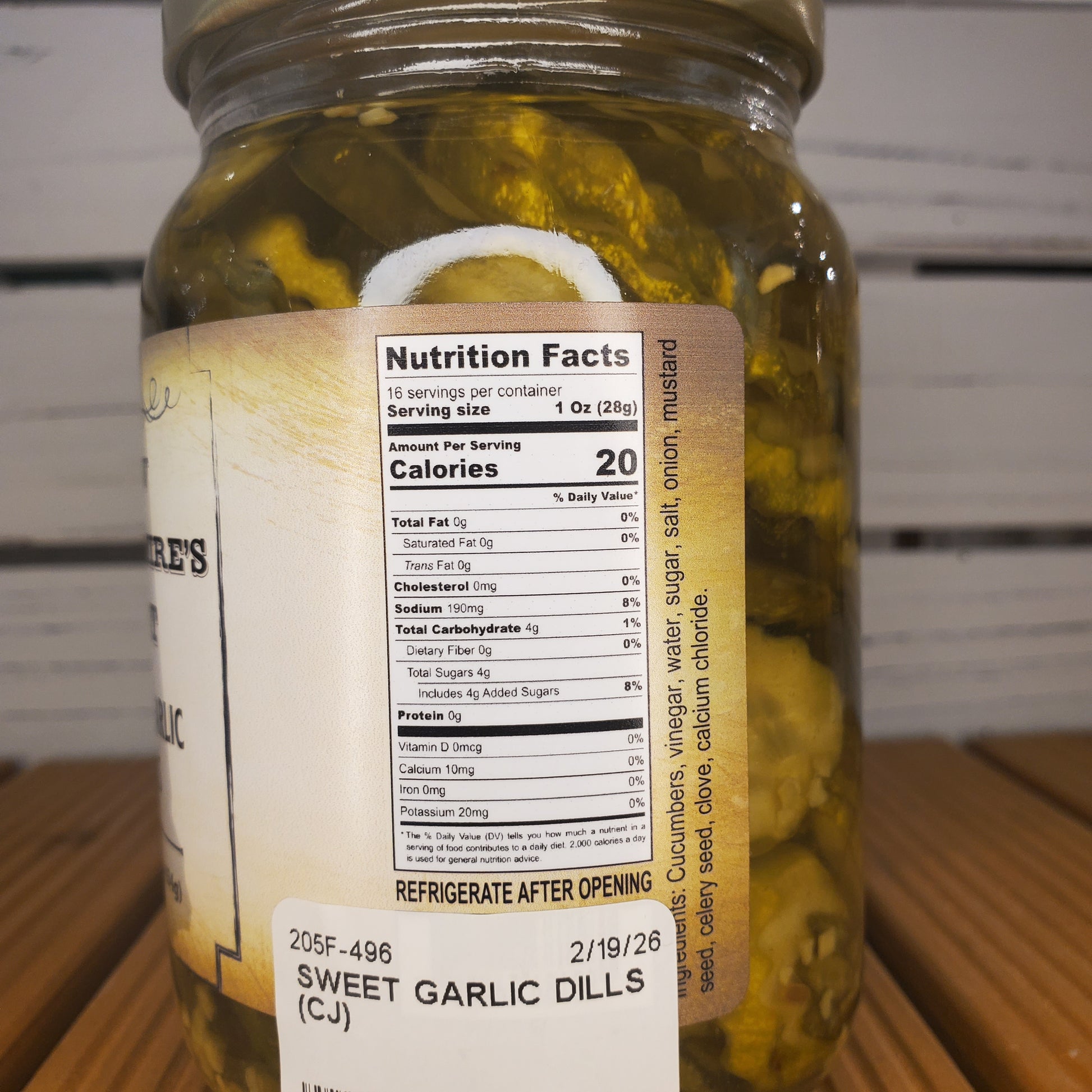 Close-up of a jar of pickles with a label showing nutrition facts.