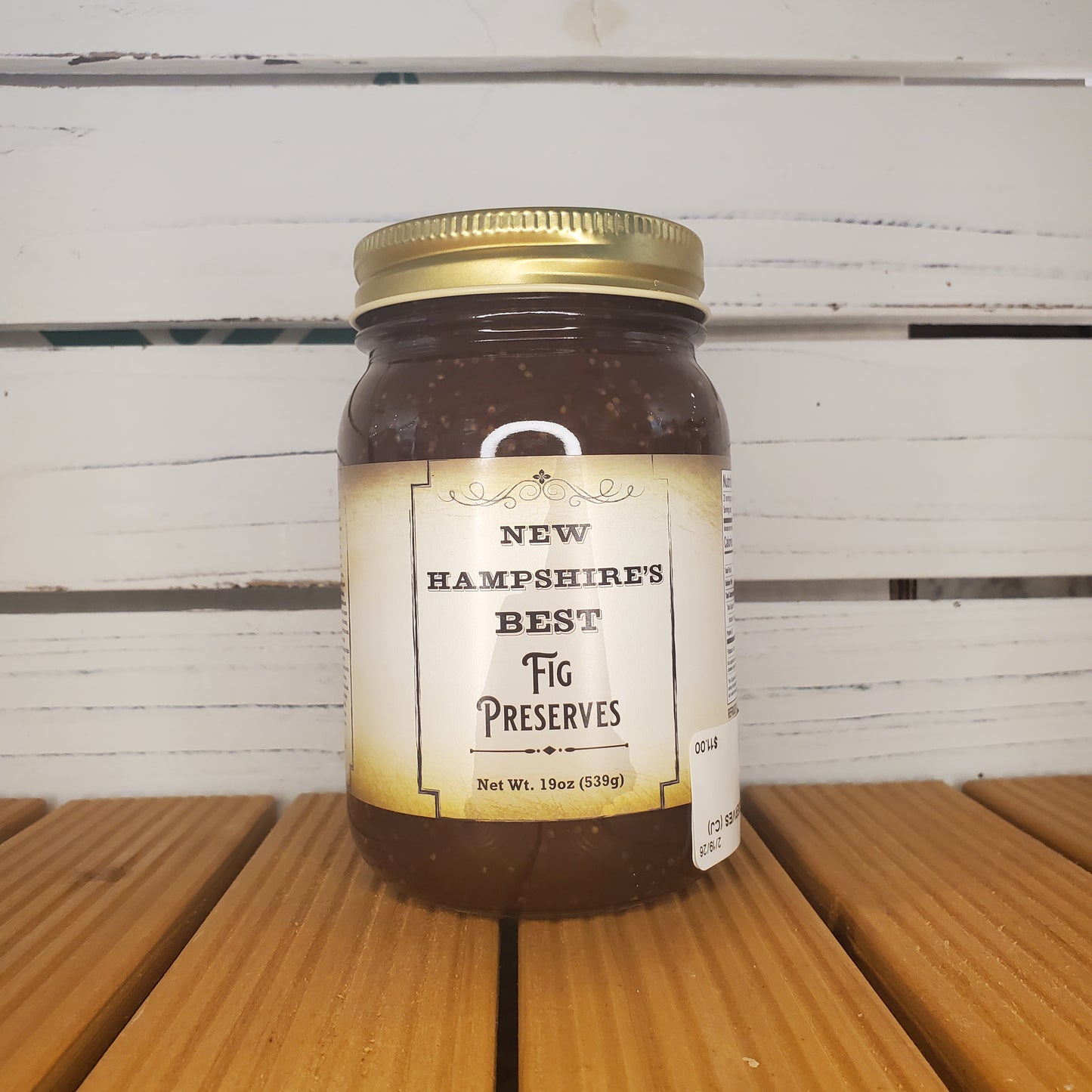 Jar of New Hampshire's Best Fig Preserves on a wooden surface