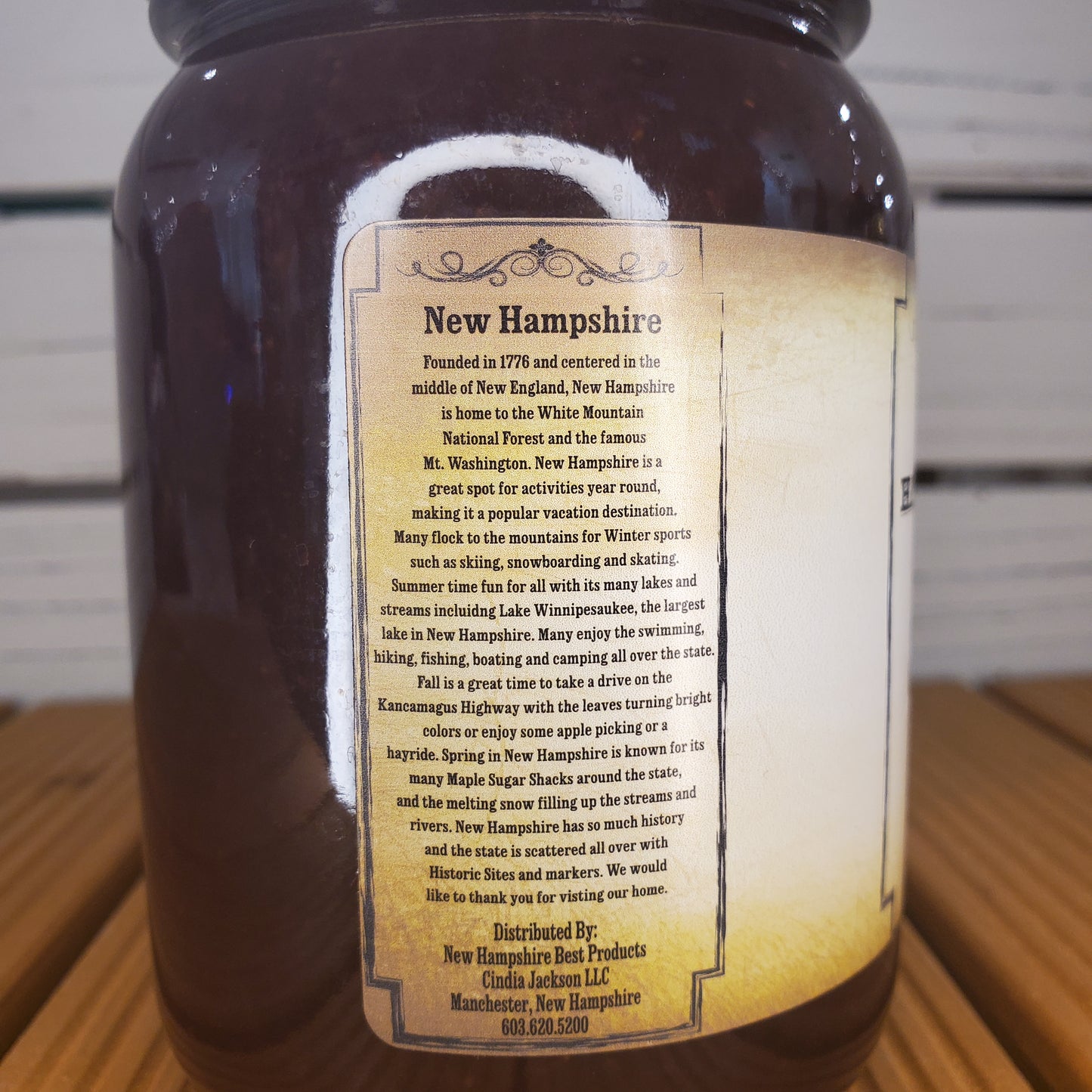 Bottle with a label on a wooden surface