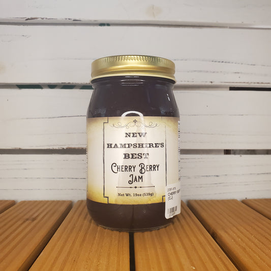 Jar of New Hampshire's Best Cherry Berry Jam on a wooden surface