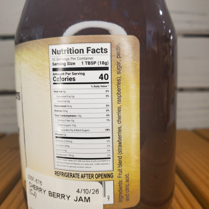 Close-up of a bottle label with nutrition facts on a wooden surface