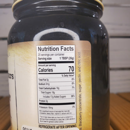 Close-up of a bottle label with nutritional information on a wooden surface