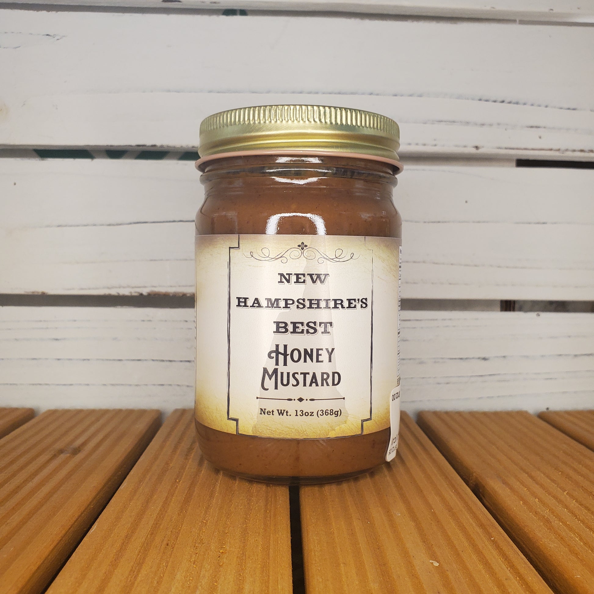 Jar of New Hampshire's Best Honey Mustard on a wooden surface