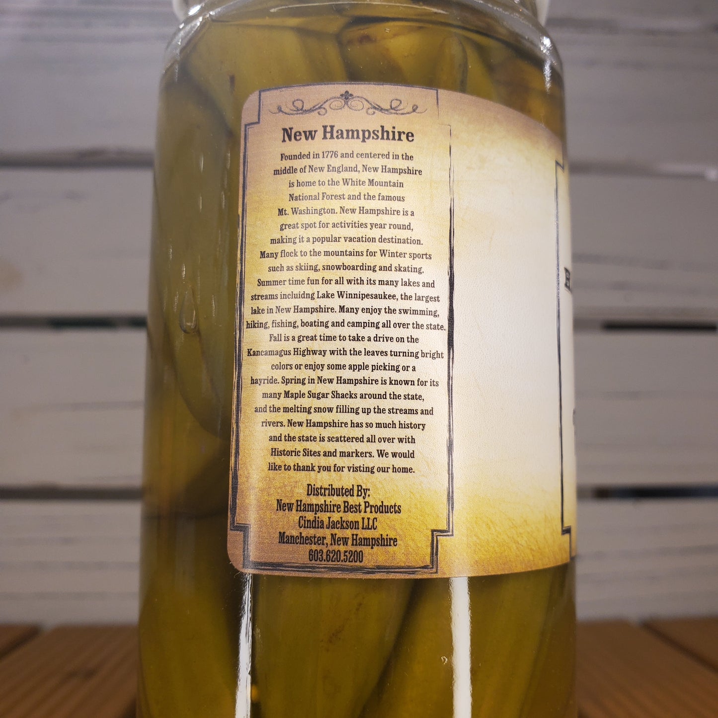 Jar of pickles with a label on a wooden surface