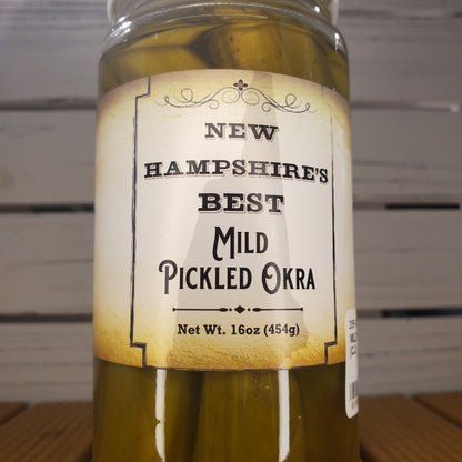 Jar of pickled okra with a label on a white background