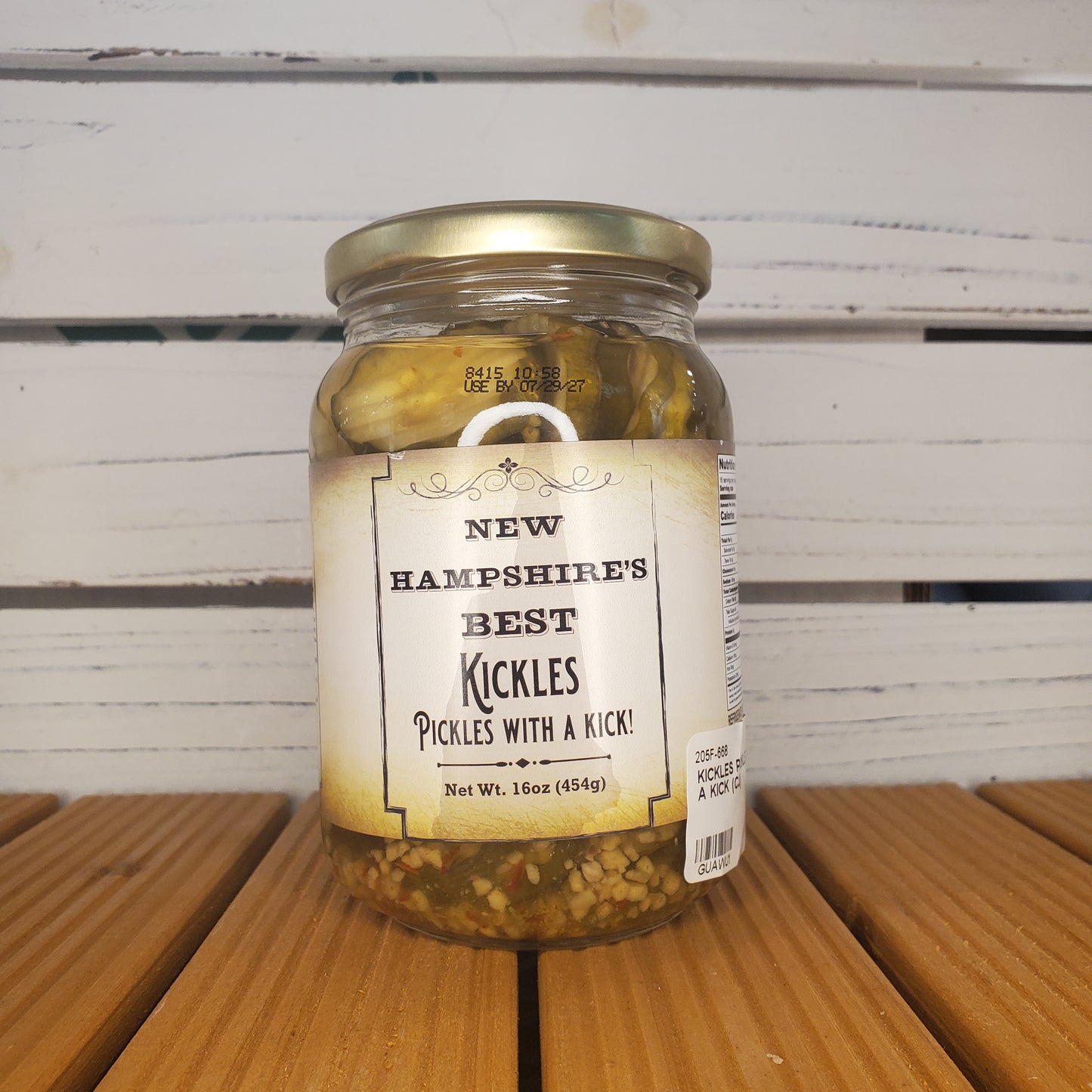 Jar of pickles with a label on a wooden surface