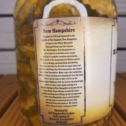 Jar of pickled vegetables with a New Hampshire label on a wooden surface.