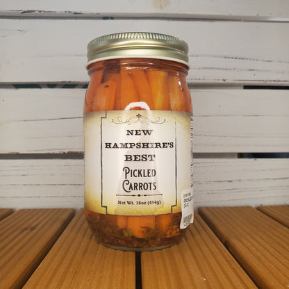 Jar of New Hampshire's Best Pickled Carrots on a wooden surface