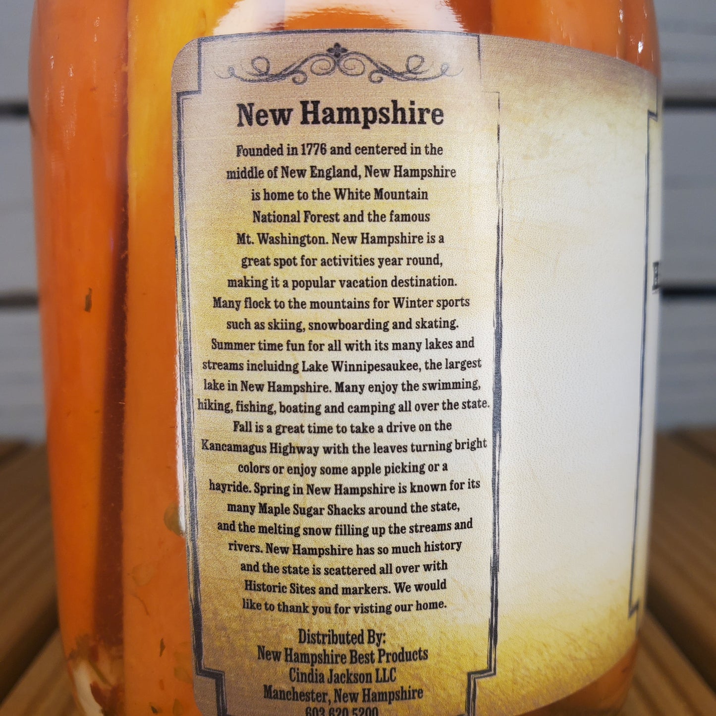 Close-up of a bottle label with text about New Hampshire.