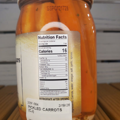 Jar of pickled carrots with a nutrition facts label on a white background