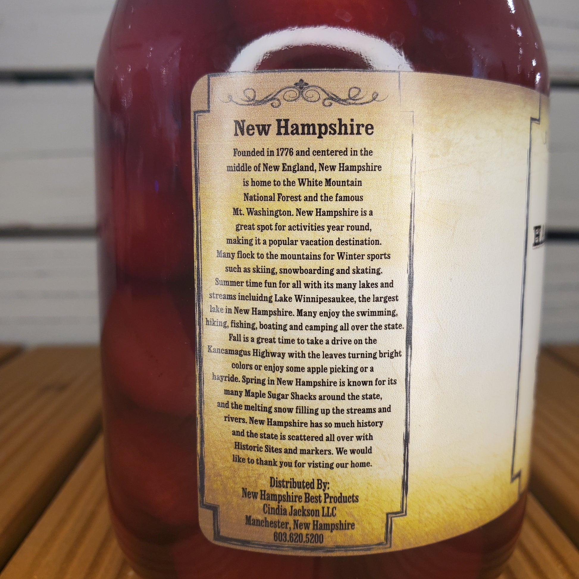 Bottle with a label on a wooden surface