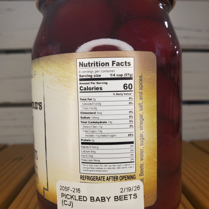 Pickled baby beets with a nutrition facts label on a white background
