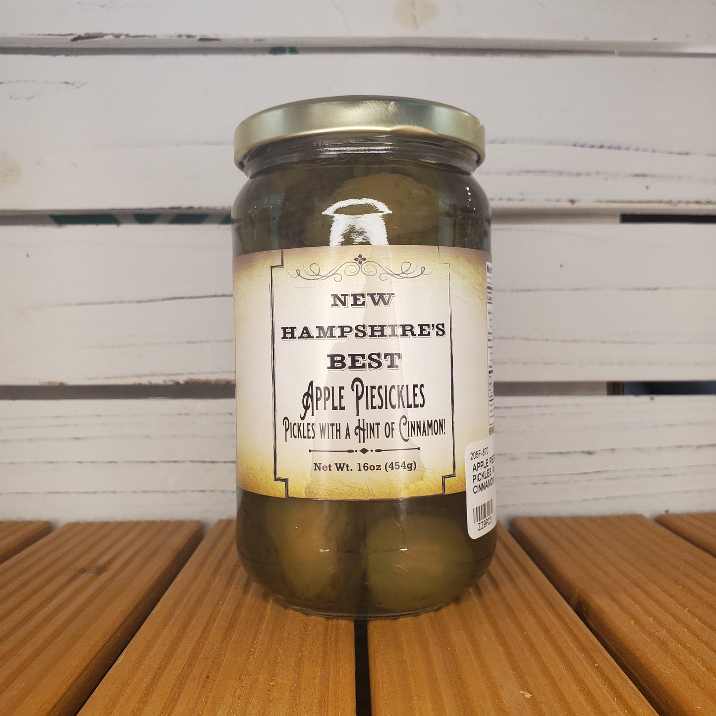 Jar of pickles with a label on a wooden surface