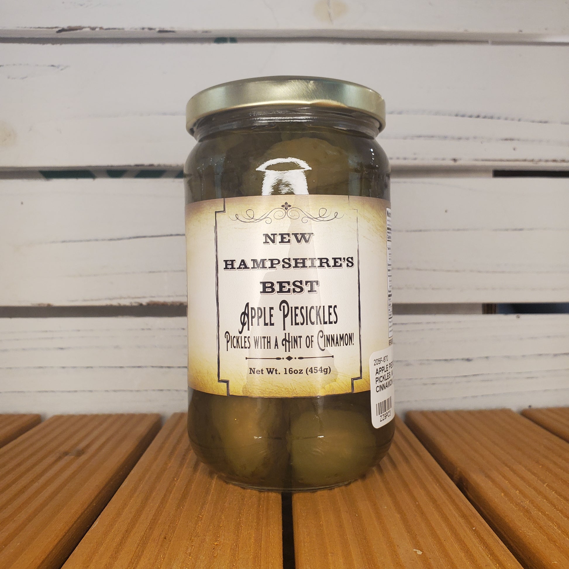 Jar of pickles with a label on a wooden surface