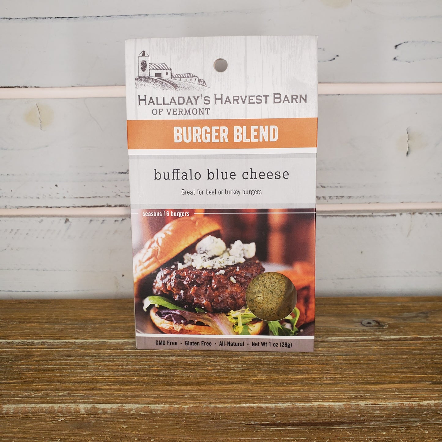 Burger blend packaging with 'Halladay's Harvest Barn' branding on a wooden surface.