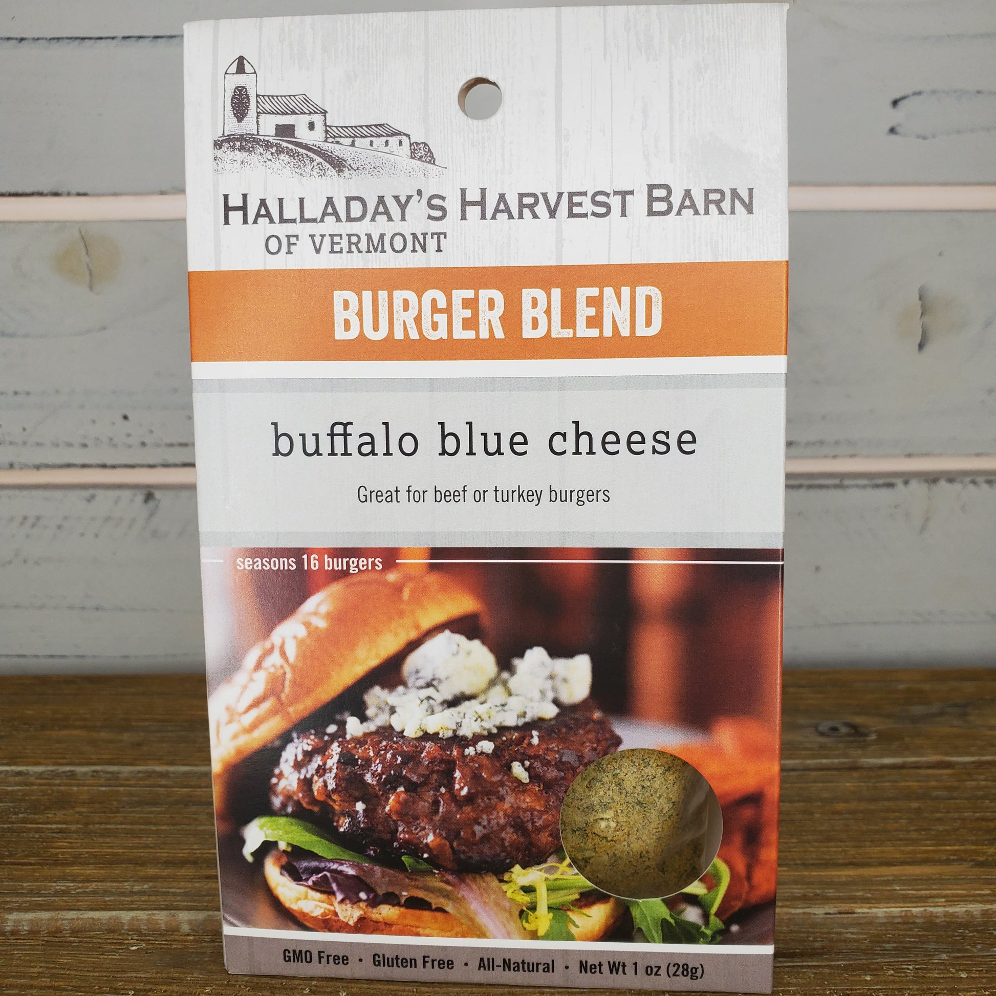 Halladay's Harvest Barn burger blend packaging with a burger image on a wooden surface