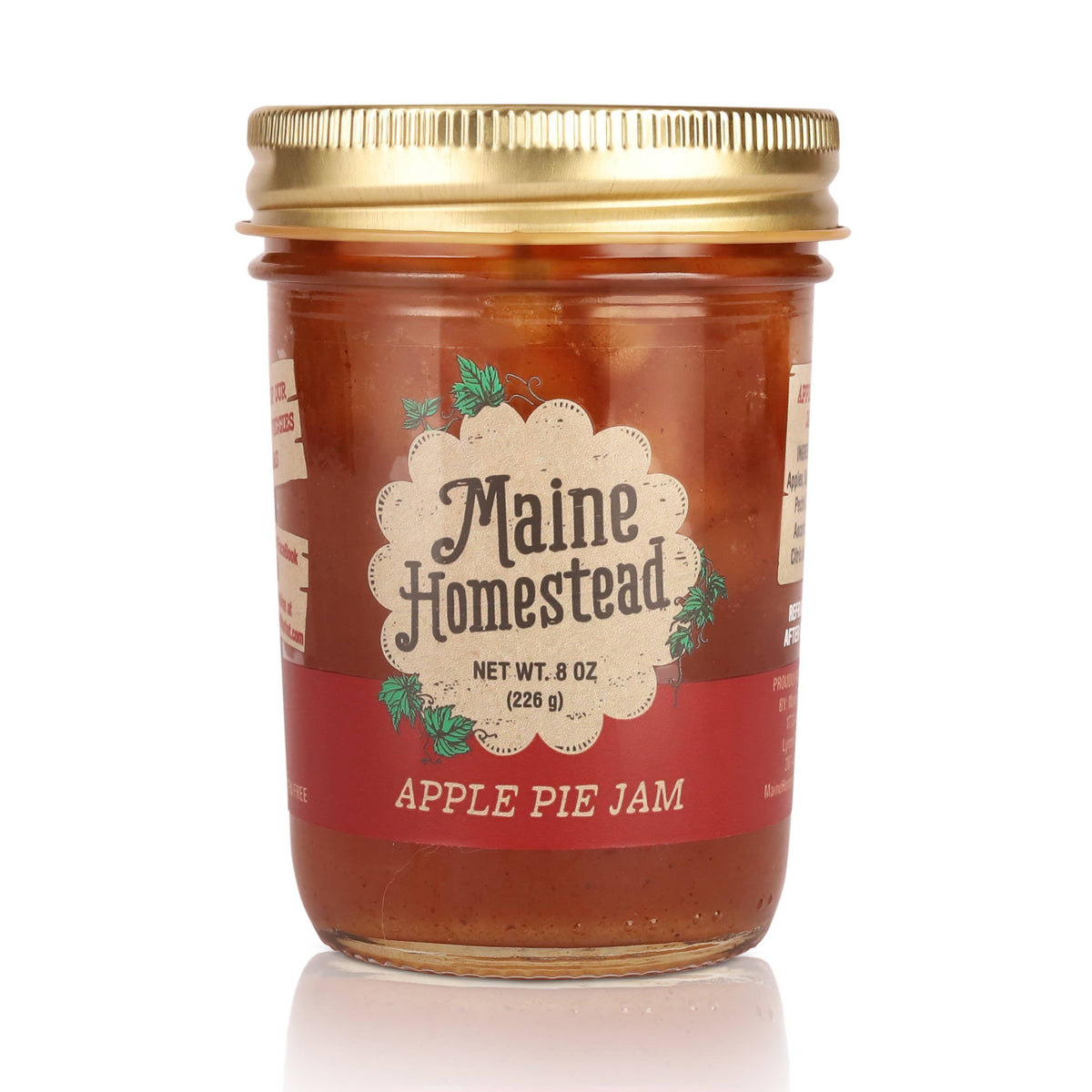 Jar of Maine Homestead Apple Pie Jam with a gold lid on a white background